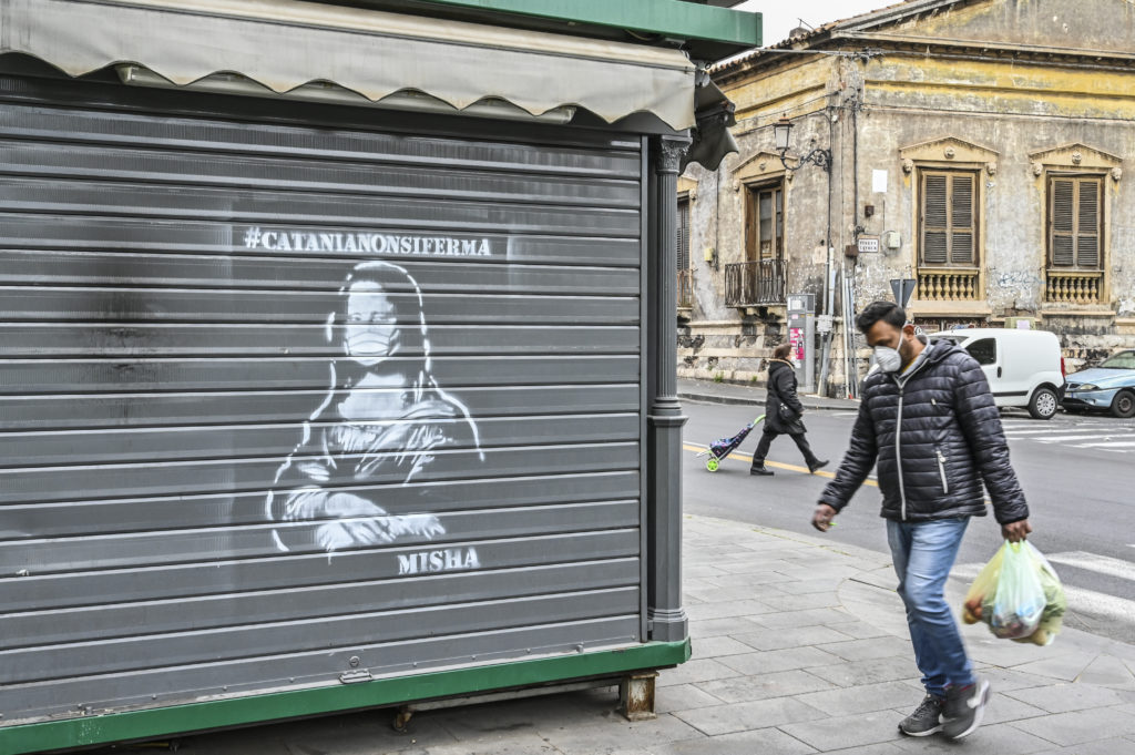 Coronavirus street art by #Catanianonsiferma (Catania does not stop) in Catania, Italy. Photo by Fabrizio Villa/Getty Images. Image