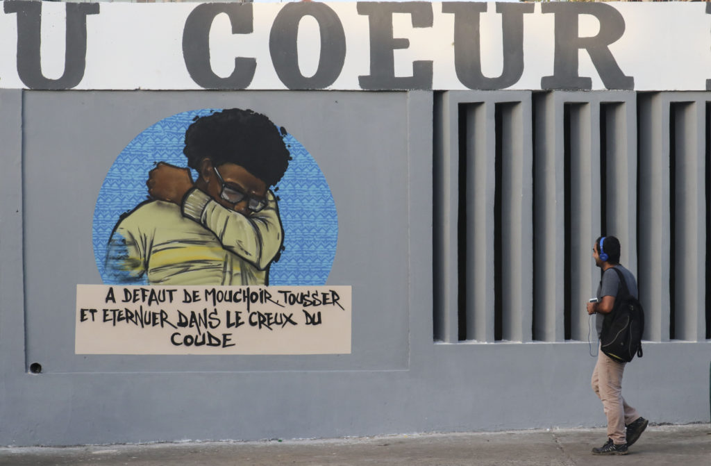 The coronavirus street art paintings of the RBS Crew collective, consisting of painters and graffiti artists, on the walls of Cheikh Anta Diop University in Dakar. Photo by Alaattin Dogru/Anadolu Agency via Getty Images. Image