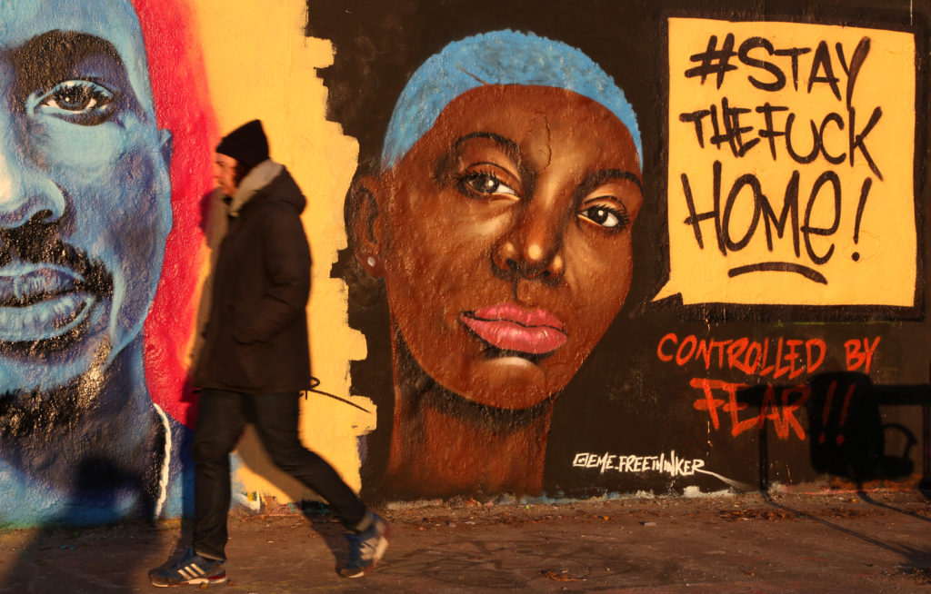 Graffiti reminding people to not leave their homes, using the popular social media hashtag #staythefuckhome, is seen during the coronavirus pandemic crisis on March 23, 2020 in Berlin, Germany. Photo by Adam Berry/Getty Images. Image